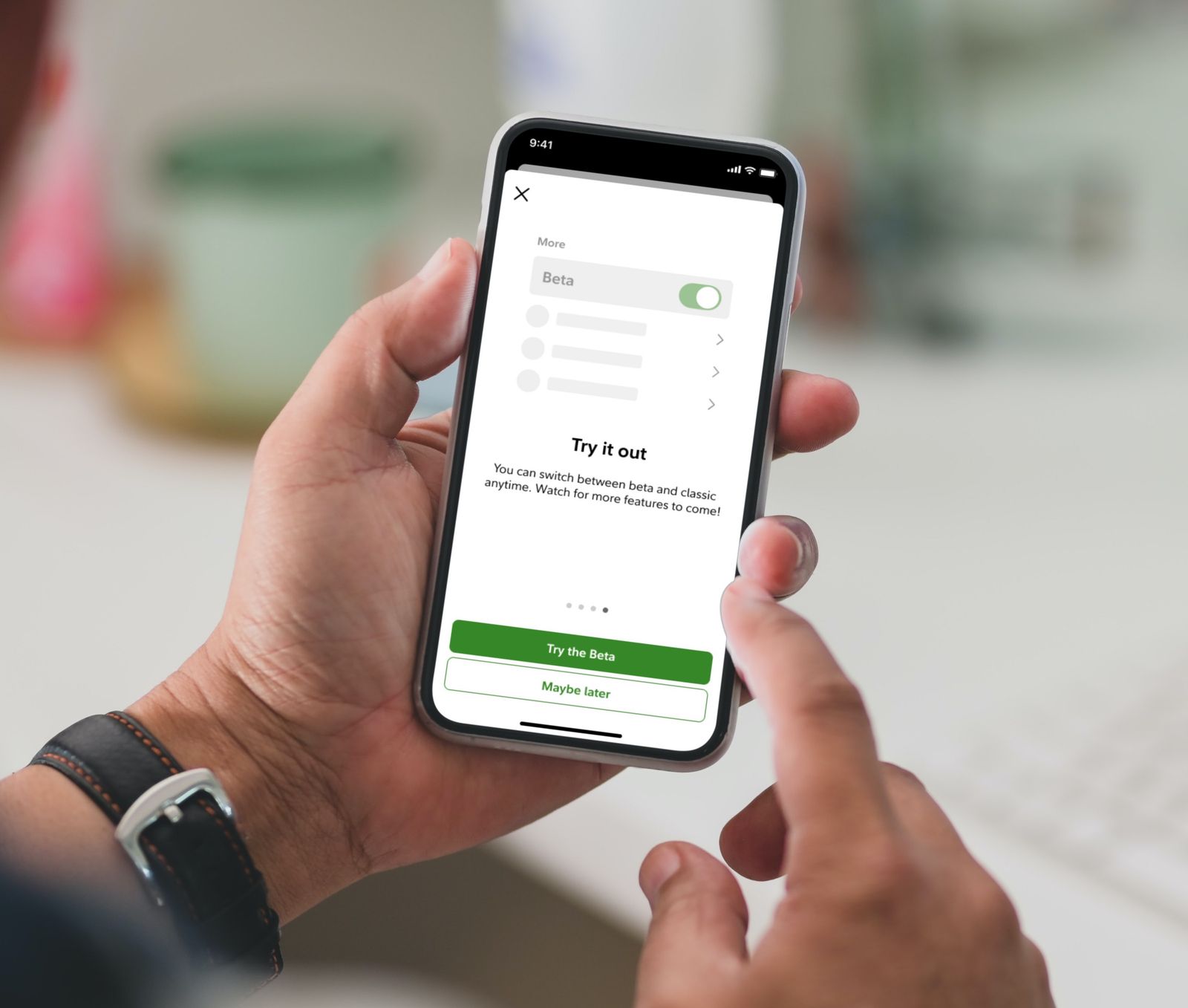 A phone showing the Fidelity app with the beta experience enabled.