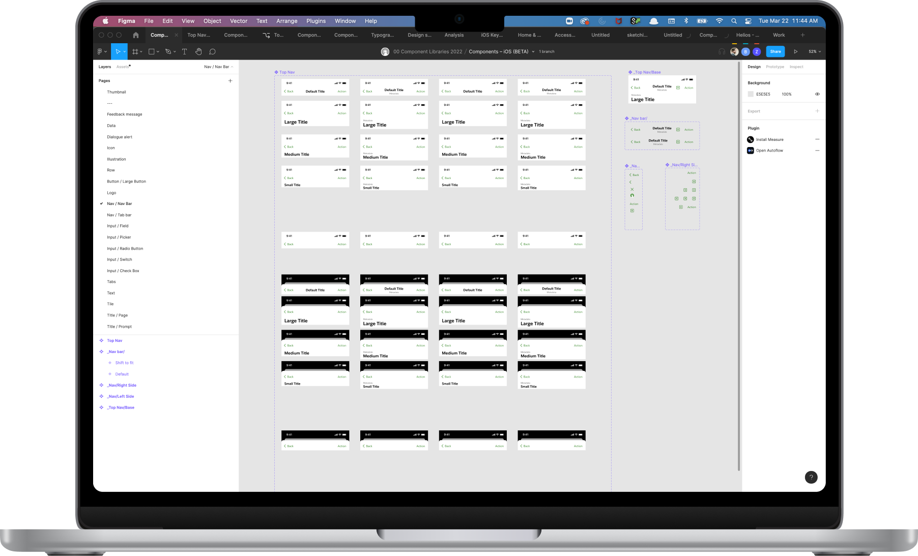 The component library open in Figma on a laptop.