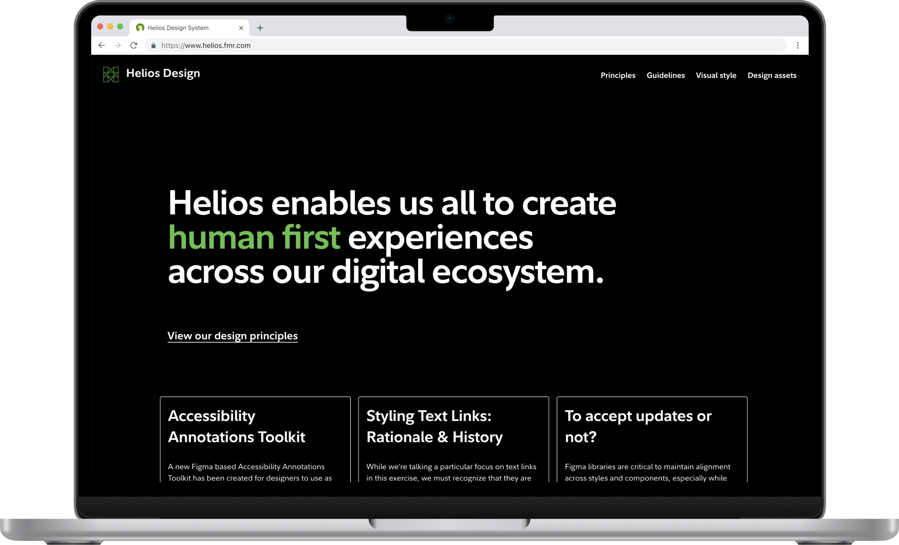 The design system site's home page on a laptop.
